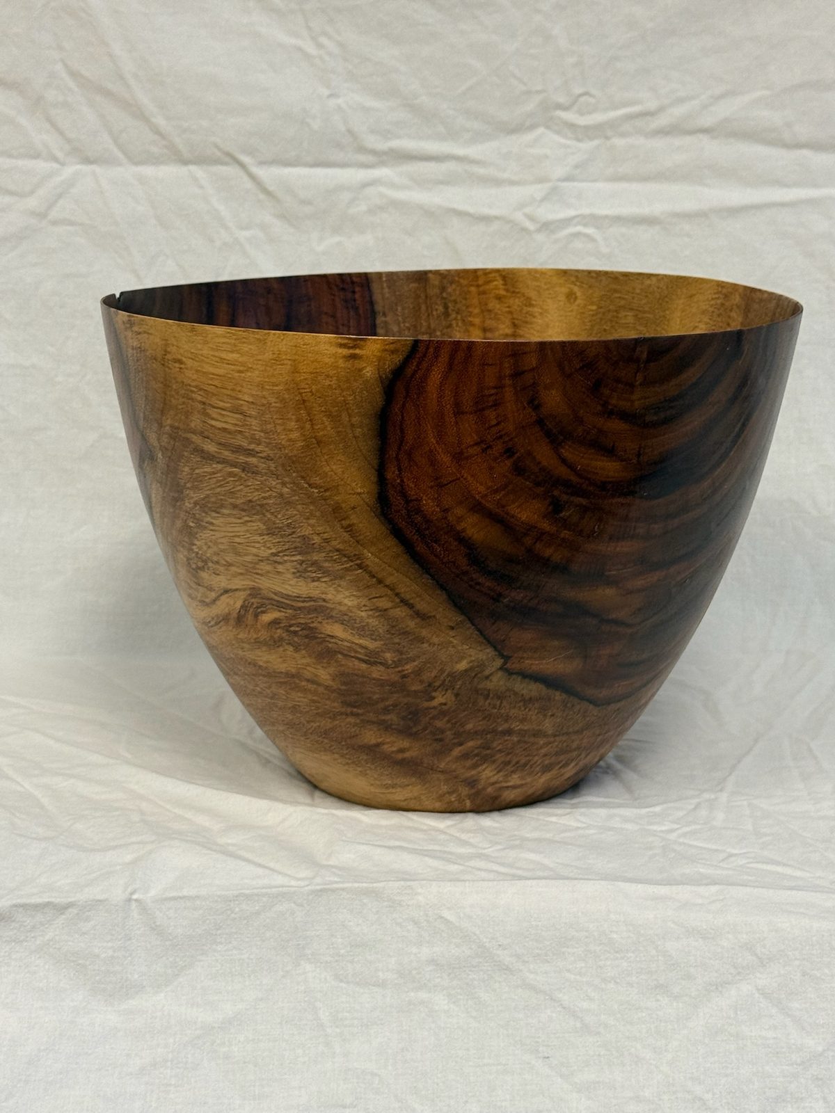 Hand-turned bowl with two-tone caramel and dark heartwood grain