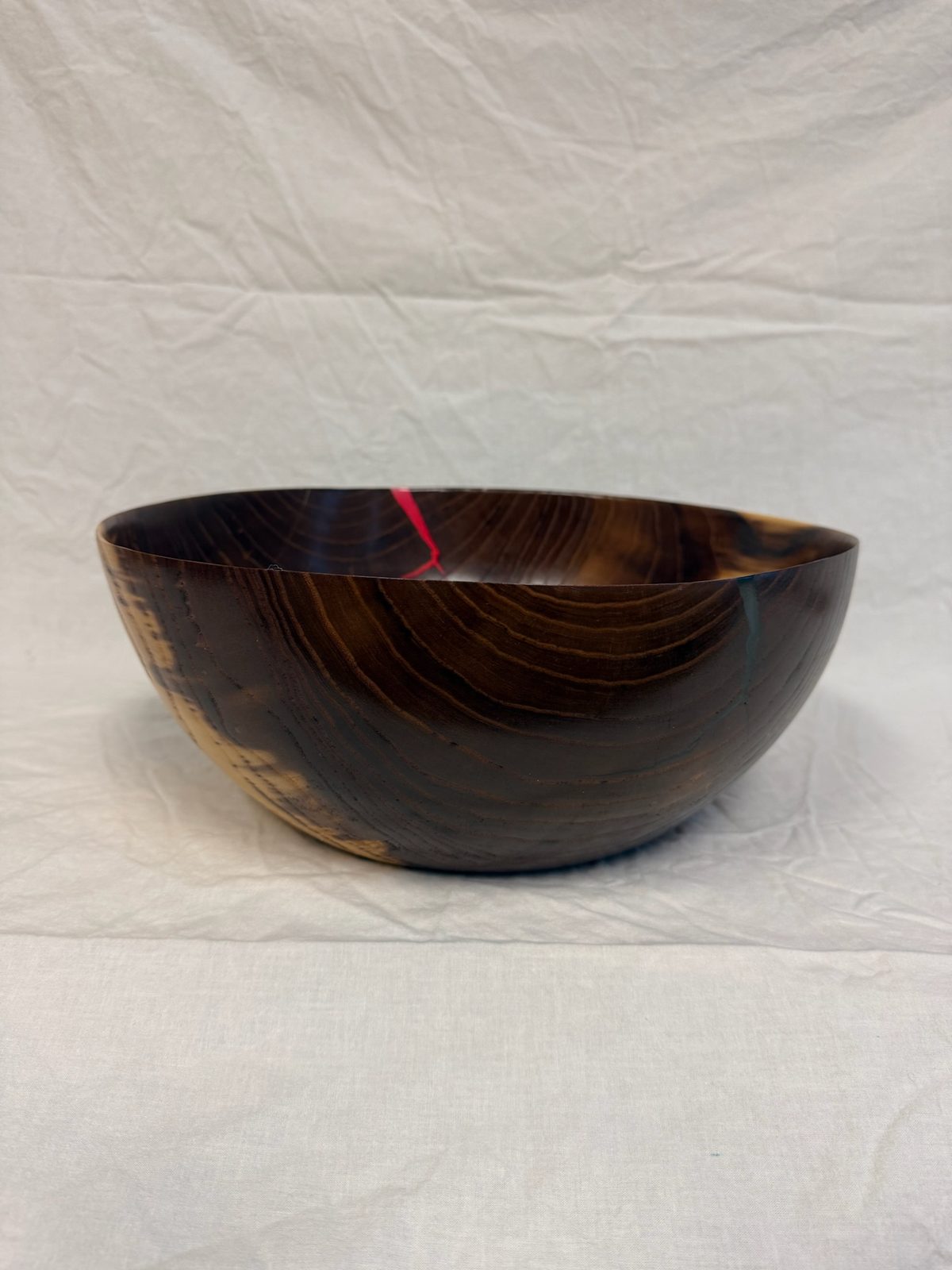 Hand-turned bowl with red and blue epoxy inlay accents