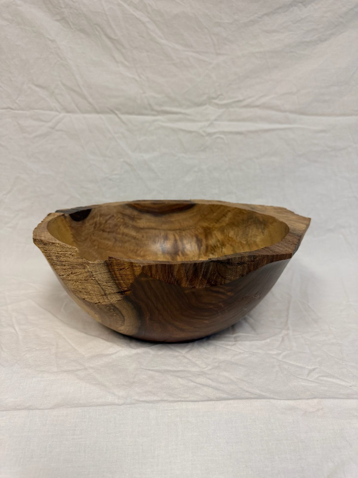 Hand-turned bowl with a natural live-edge rim