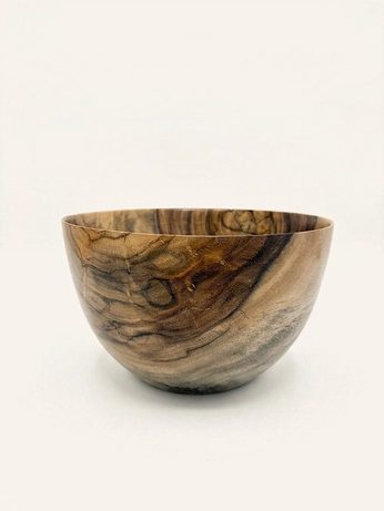 Hand-turned bowl in gray-brown wood with fine dark grain striping